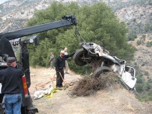Jeep Rolls Down Embankment