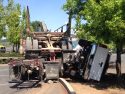 Big Rig without trailer into pickup truck on its side.
