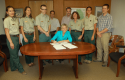 Joined by fellow staff, Susan Skalski, Forest Supervisor, Stanislaus National Forest signs the Record of Decision on the Rim Fire Recovery Project