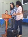 Quilts made by Charlene Heller held by Patty Aguiar and Irma Ramos