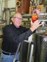 Indigeny's Jay Watson with Apple Brandy bottle