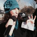 Star 92.7's Maryann with surprise $1,000 Donation Check at Santa Fly-in