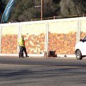 Painting retaining wall along Mono Way