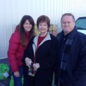 A-TCAA Food Bank Director Lee Kimball with donors Alida Carlson and Tuolumne County Board of Supervisors Chair John Gray