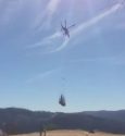 Helicopter spreading wood shreds