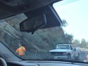 Crew working on rockslide removal and fence repair on the Tuolumne County side of Lake Tulloch Bridge