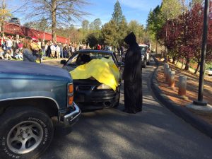 Grim reaper standing over body at "Every 15 Minutes" program