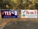 Yes On Measure D and No On Measure D signs hanging near Greenhorn Creek