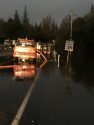 Fire truck pumping flood waters from Parrotts Ferry Road