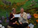 Lynn McCormick, on left, and Donna Schiavo presenting the first $5000 for the purchase of children’s and young adult books