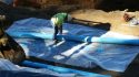 Construction contractors are working to install French drains for drainage control.