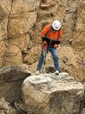 Caltrans crew worker blasts fallen boulder, part of the 2017 winter deluge on the Mother Lode passes