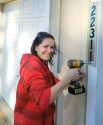 Habitat For Humanity of Tuolumne County, Parrots Ferry Village, Michele Installs Address Marker.