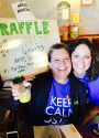Jen Lopez, TC Visitors Bureau and Laura Jennings, Century 21 taking tickets at the door of the Leadership Tuolumne 2017 Foster Kids Fundraiser at the Sheriff's Posse Clubhouse.