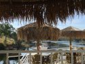 Lake Tulloch through patio umbrellas at Drifters Marina restaurant, May 10, 2017