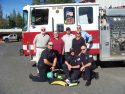 Engine 771 from l to r, back row to front row: Mike Welch, Board President, Sherry Blake, Auxiliary President, Bill Schneiderman, Board President during grant request, Darrell Slocum and Lin Freer, Sonora Area Foundation, Captain Drew Collier, Brendan Danicourt, intern fire fighter, and Chief Larry Crabtree.
