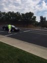Local law enforcement operation in crosswalk with officer plant