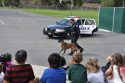 Sgt. Michael Pershall and Ike give a demonstration to local kids