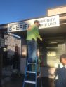 Inmates cleaning and painting the Sheriff's Office Community Service Building in Jamestown
