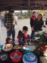 Kids enjoying goodies at 2017 Santa Fly-in and Interfaith Coast Drive