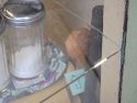 Broken window at the Community Thrift Shop