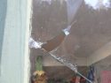 Broken window at the Community Thrift Shop