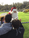 St. Nick gives high-fives at 2017 Santa-Fly-in and Interfaith Coat Drive