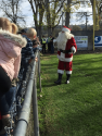 St. Nick greets kids before settling in at 2017 Santa-Fly-in and Interfaith Coat Drive