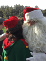 St. Nick smooches Mrs. Claus at 2017 Santa-Fly-in and Interfaith Coat Drive