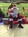 St. Nick takes first guest on his knee at 2017 Santa-Fly-in and Interfaith Coat Drive