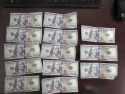 Blue mark from counterfiet money detector pen signaling fake bills