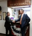 Bill Pooley (left) is joined by Sheriff Mele while filing election papers