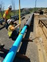 New pipe being inserted into the protective steel casing