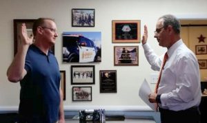 Former Lt. Commander Sonora CHP Unit Scott Clamp being sworn in by Tuolumne County Sheriff Jim Mele