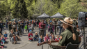 Park Ranger Kate performs music on the Earth Day Stage.