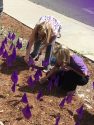 Kristin Cruz, Fiscal Technician, Tuolumne County District Attorney's Office and Victim Witness and Kristin Millhoff, Director, Area 12 Agency on Aging - inserting flags representing the 144 elder abuse victims in Tuolumne County