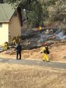 Vegetation fire behind a Soulsbyville home
