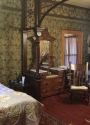 Utica Mansion upstairs front bedroom with millwork screen room divider