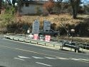 Protest signs across from TuCare Natural Resources Summit