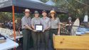 Yosemite National Park Superintendent Michael Reynolds (left) honors Colin Lang, Athena Demetry, and Molly Downer, Yosemite National Park, Vegetation and Ecological Restoration as the 2018 Volunteer Program of the Year.