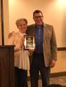 Habitat For Humanity receives Non-Profit of the Year Award (Executive Director Trinity Abila with award sponsor Jeff Redoutey of Blue Mountain Minerals)