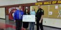 First place winner Ava Cable (holding poster in middle) receiving the $150 grand prize check with (right to left) Calaveras County Superintendent of Schools Scott Nanik, CC Distric Attorney Barbara Yook and Sheriff Rick Di Basilio