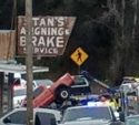 Tow truck pulling pickup out of creek on Stockton Road
