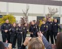 Family members capture group photo of deputy hiring and promotions ceremony Feb 25 2019