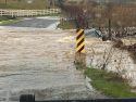Vechile submerged in flood waters on Sims Road in Chinses Camp area