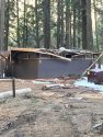 Downed trees damage park restroom