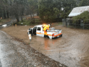 Caltrans Area Supervisor James Rees works on clearing a culvert Feb. 14 2019 The storm closed a stretch of Highway 26 for nine weeks
