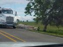 Overturned semi and trailer full of lumber