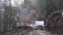 Slideout repair in progress along section of Hwy 26 closed for several weeks due to extensive damage from Feb 14 2019 storm