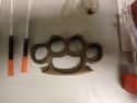 Brass knuckles found in drug bust